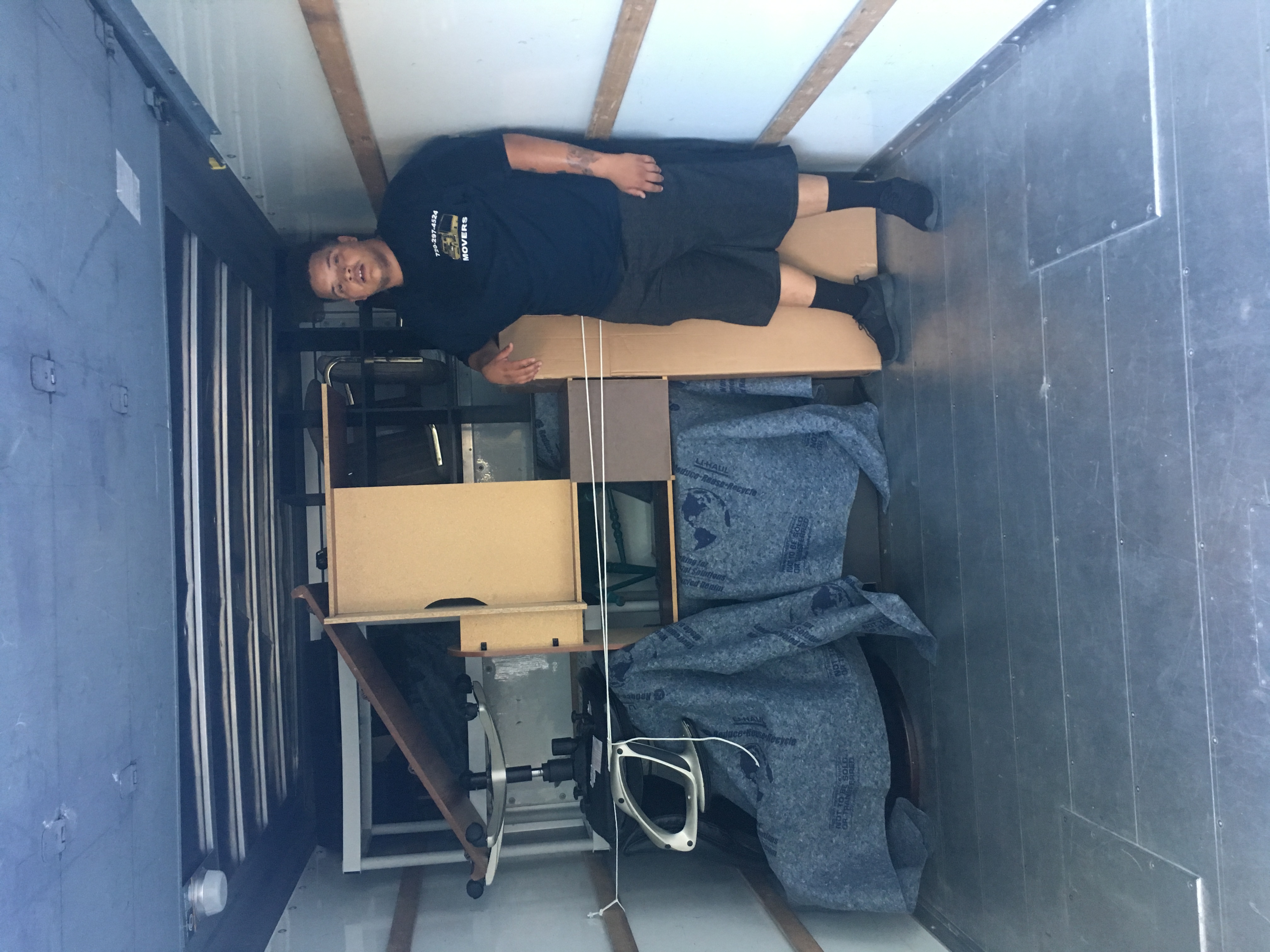 Mover with a wrapped armoire and dresser