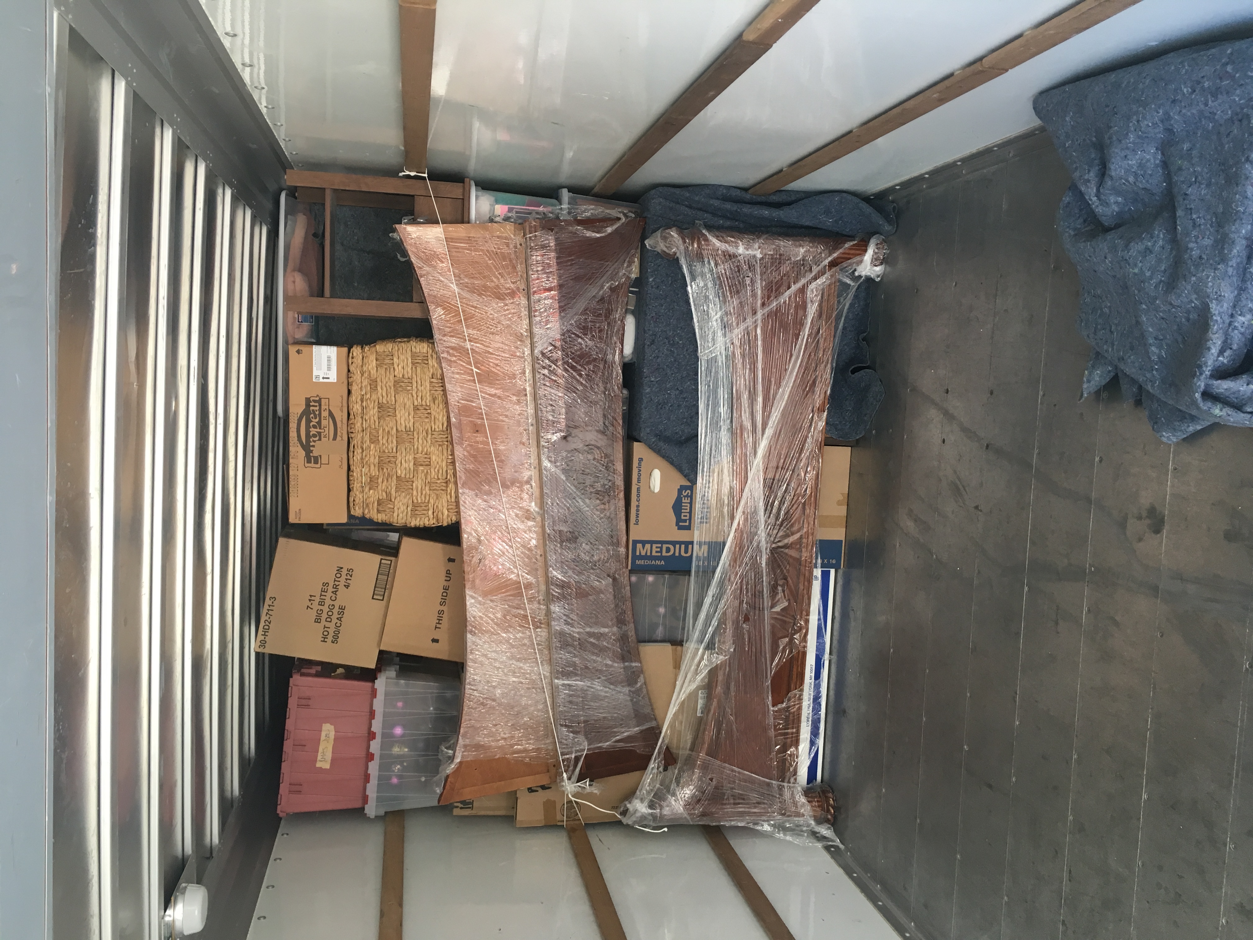Wrapped fragile items secured with rope